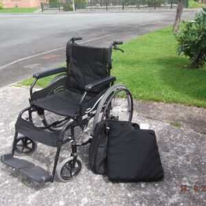 WHEELCHAIR WITH BAG AND CUSHION.